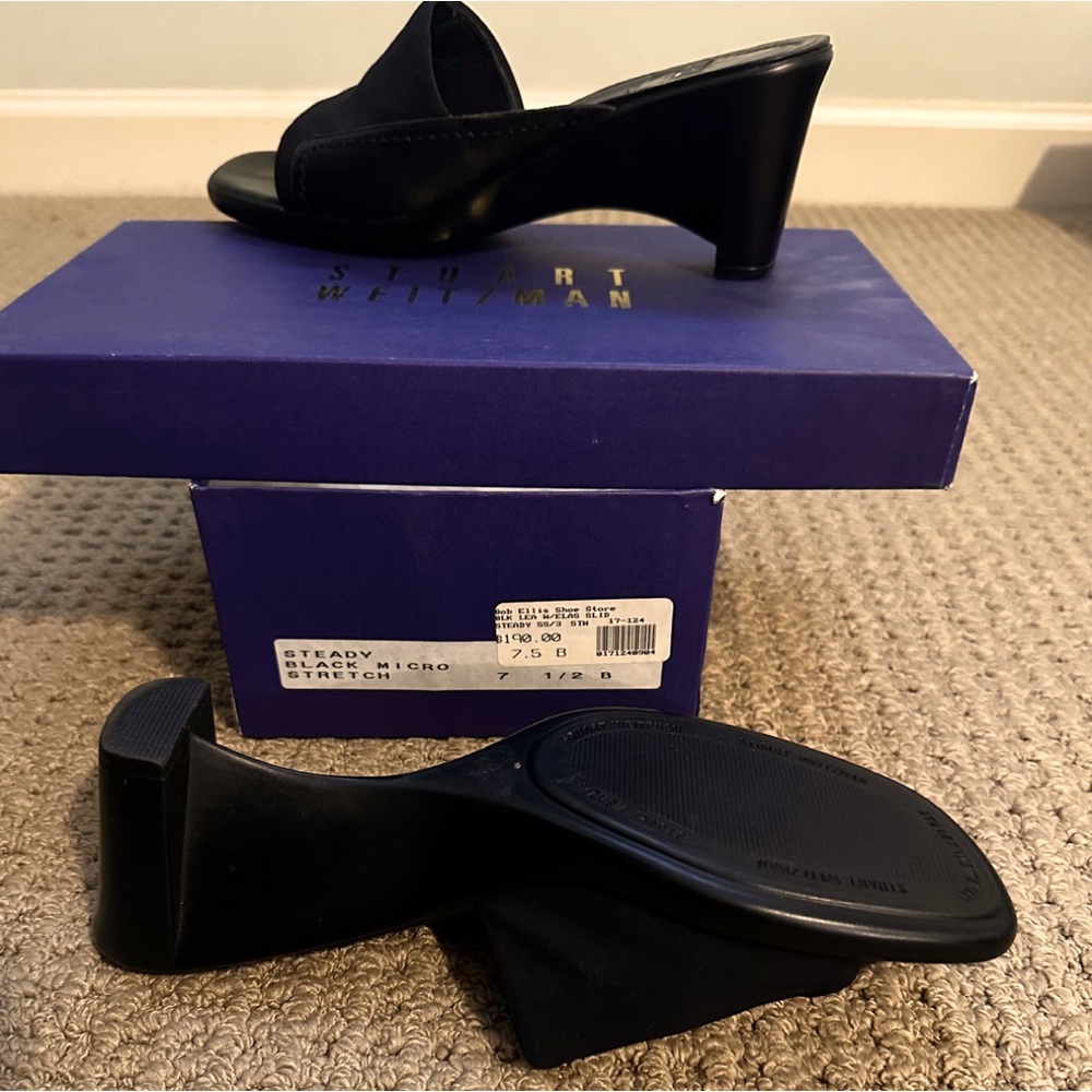 Barely worn Stuart Weitzman Black wedged heel